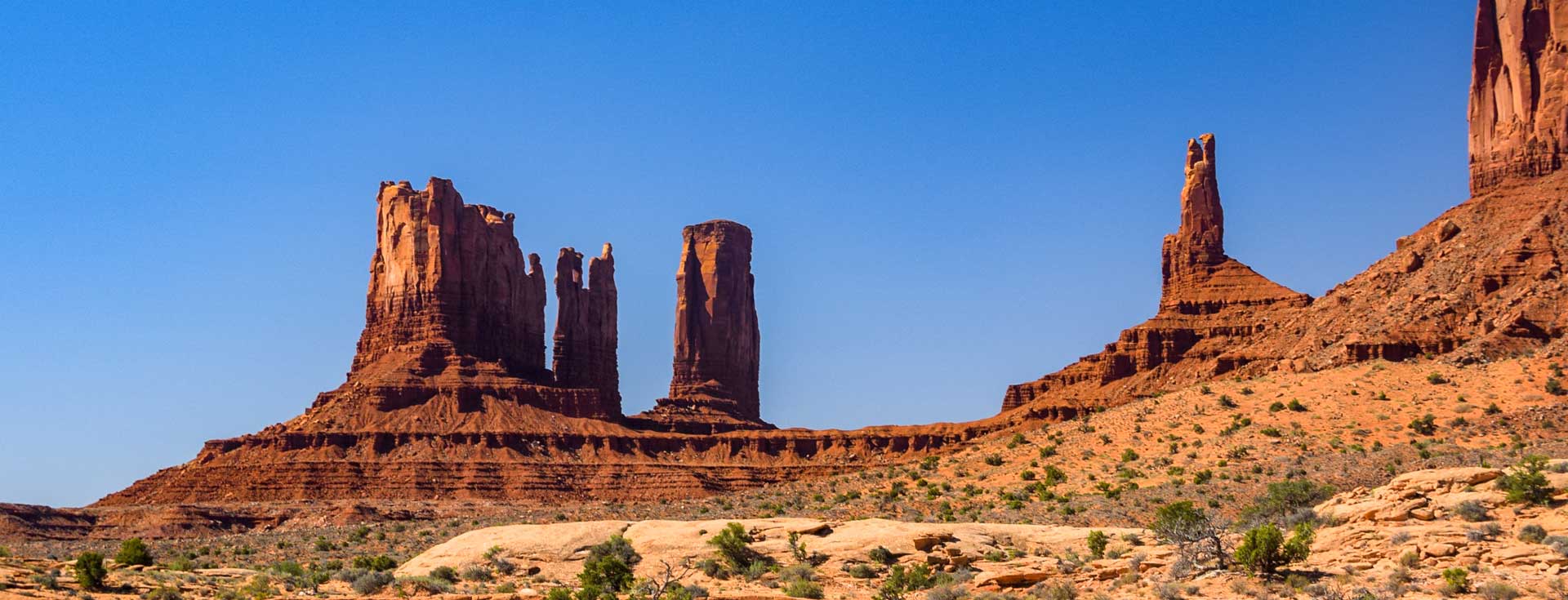 Tall red rock spire formation in the desert southwest