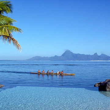 outrigger canoe with island in background