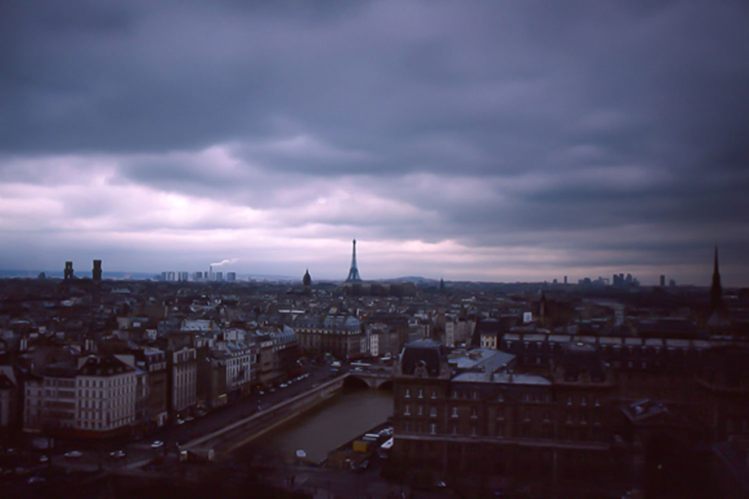 dark heavy clouds overshadow the Paris skyline