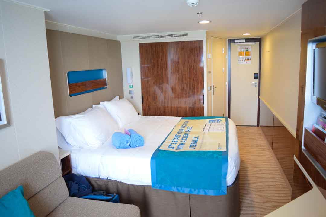 stateroom of a mass market cruise line used to show difference in cruise lines