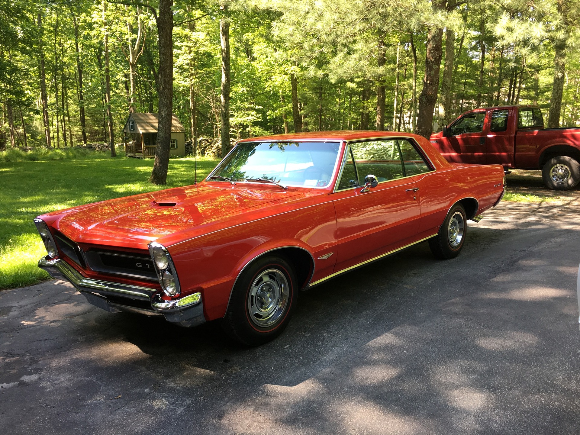 Red Pontiac GTO helps demonstrate difference between cruise lines