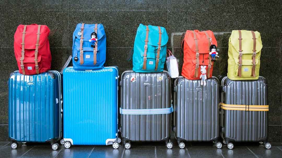 photo of luggage lined up at airport
