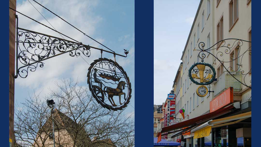 two photos showing examples of the elaborate wrought iron signs used by stores. one shows a horse, the other shows two shoes