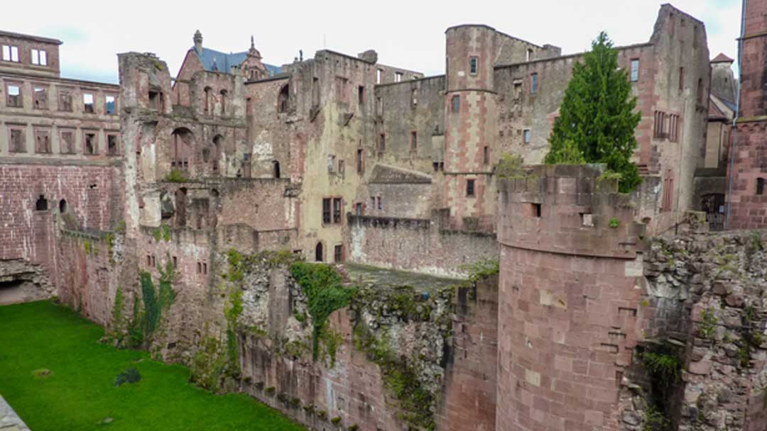 Large old partially destroyed castle, walls appear to have crumbled at some time in the past