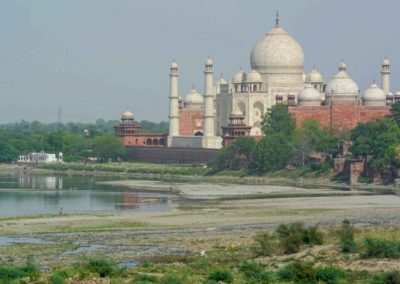 Picture of the Taj Mahal from outside the complex. River is visible next to it.
