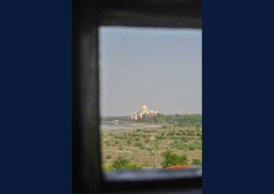 Small rectangular opening through which the Taj Mahal can be seen.
