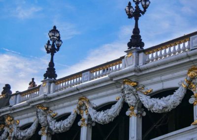 white bridge elaborately decorated with gilt accents
