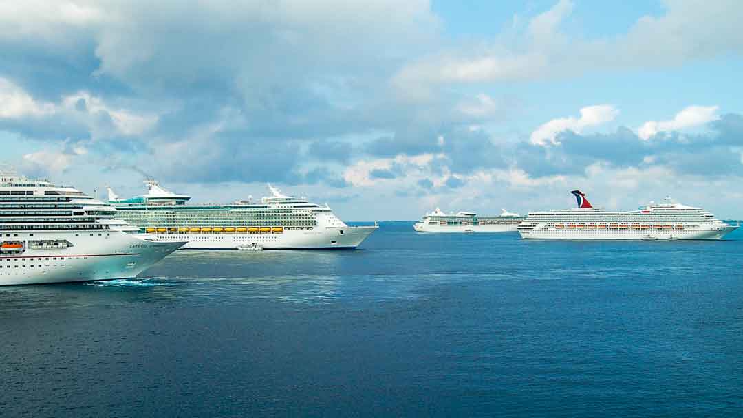 Shot of multiple cruise ships together at sea