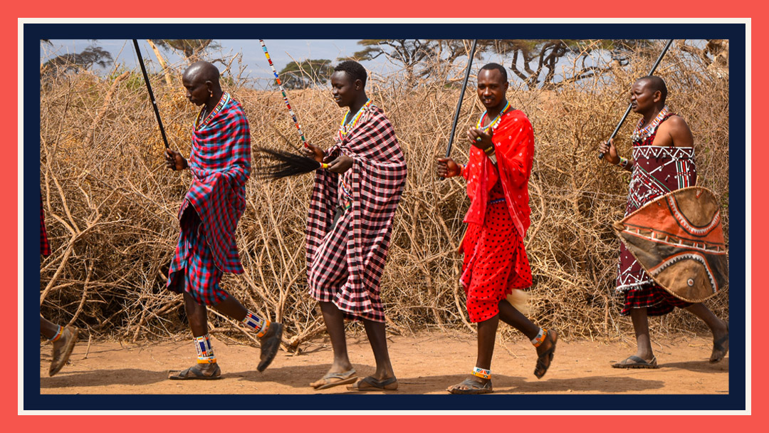 Four Maasai men walking together. Maasai culture is one of the reasons to take an African safari.